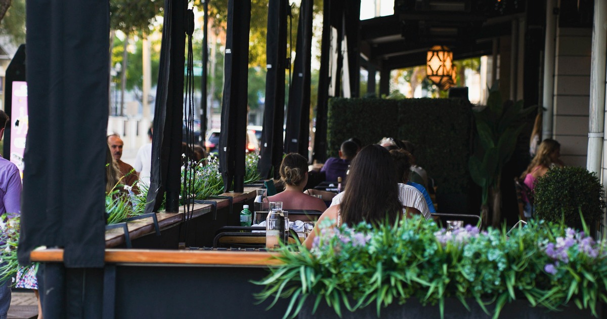 Exterior, tables and chairs with guests