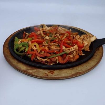 Chicken fajitas dish, served.