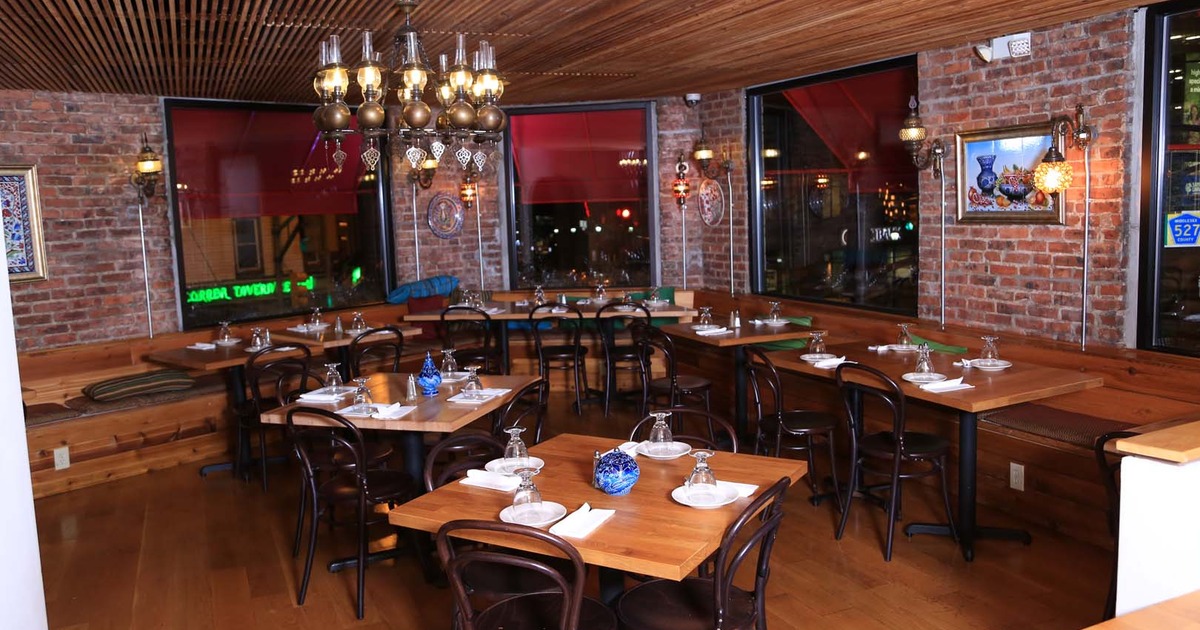 Cozy interior dining area with set tables ready for guests