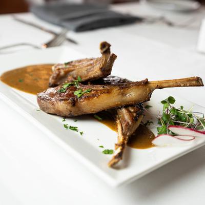 Grilled lamb lollipops, in brandy peppercorn sauce