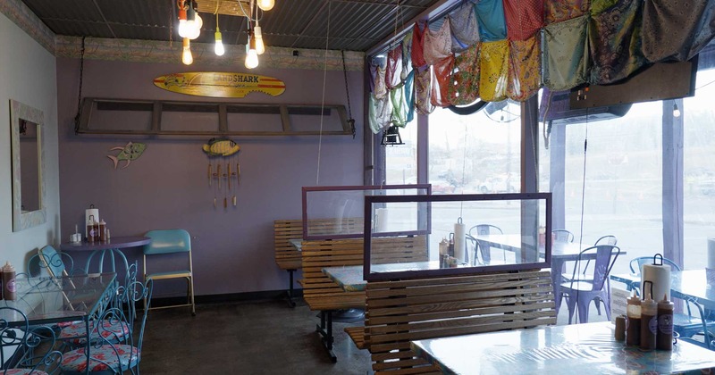 Dining area, tables and benches next to the restaurant window