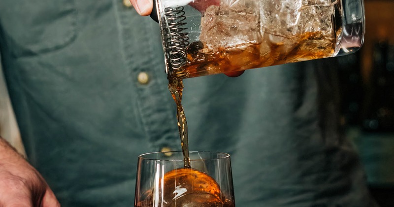 A bartender preparing a cocktail