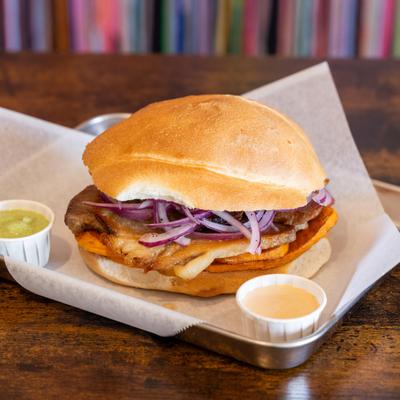 Braised pork sandwich, with sweet potatoes, and red onion.