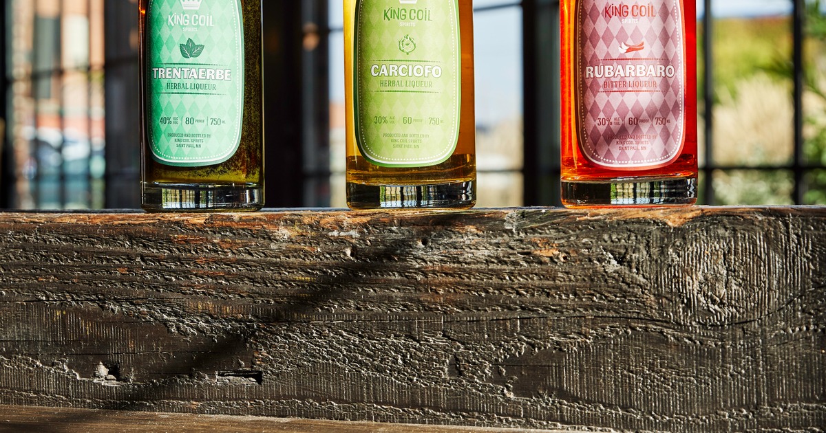 Three bottles of King Coil Spirits herbal liqueur