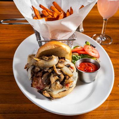 Bacon cheeseburger, with caramelized onions, mushrooms, and sweet potato fries.