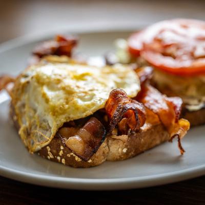 Breakfast BLT sandwich, with a fried egg.