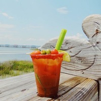 Bloody Mary glass on a deck outside.