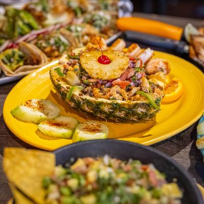 Jose Pina on a table with tacos and guacamole.