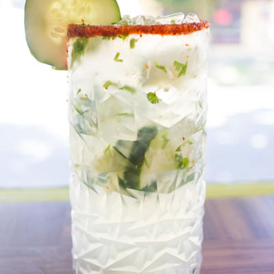 A served cucumber margarita mix.