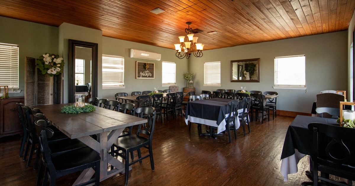 An event room with arranged tables and chairs