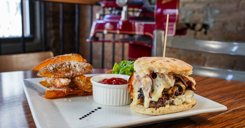 San Matteo Burger Piemonte beef, quadrelo di bufala, carmelized onion, radicchio, smoked bacon, potato wedges, pizza bun.