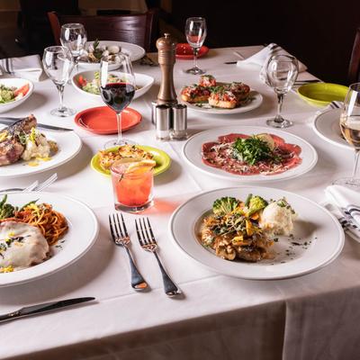 A table spread with assorted dishes and drinks.