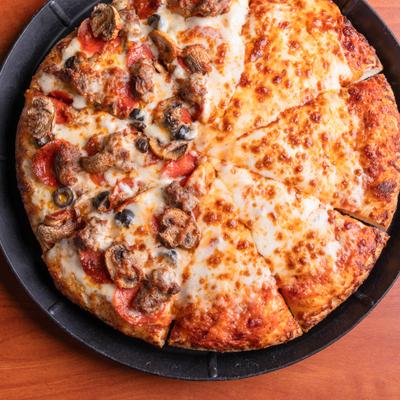 Half Cheese Half italian garlic combo pizza, served on a black plate.