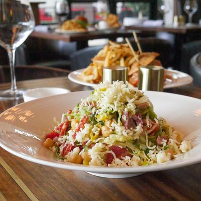 Chopped salad, with mixed greens, chickpeas, peppers, and shredded cheese