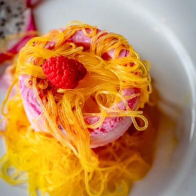 Homemade ice cream flavored with cardamom and pistachio nuts.