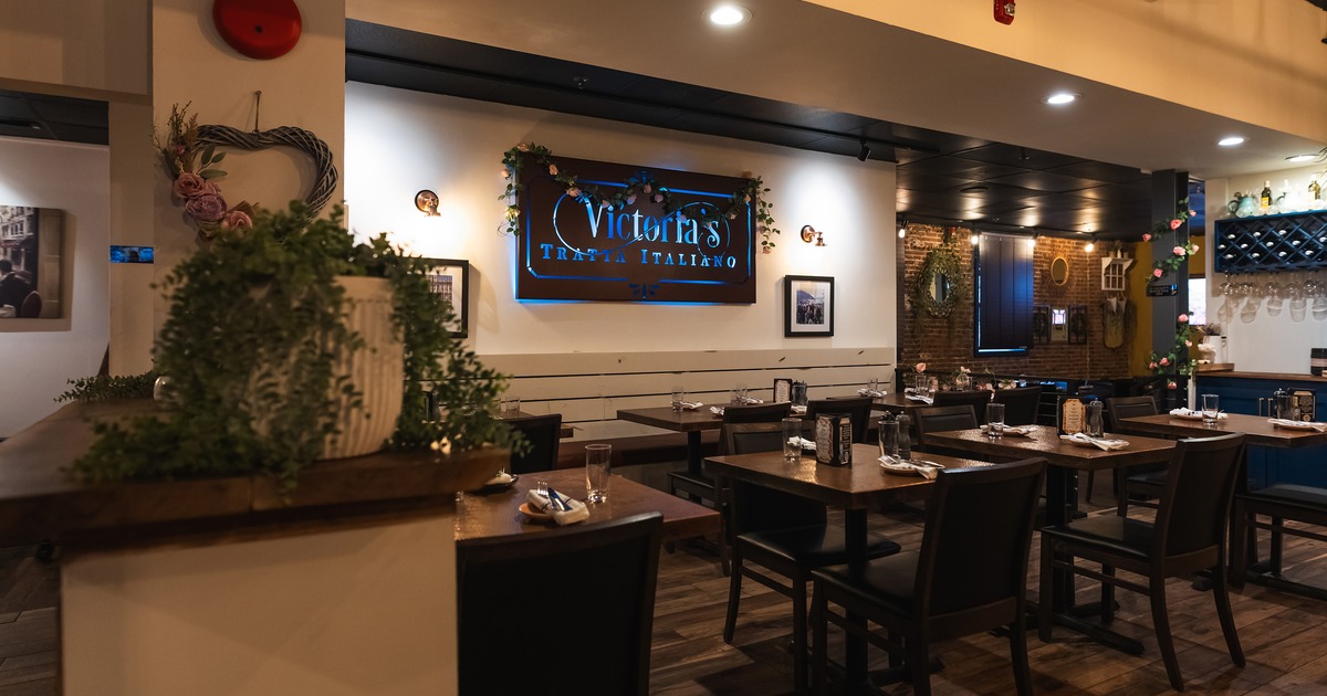 Modern and cozy restaurant interior dining area with set tables