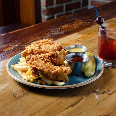 Chicken strips with choice of sauce and fries.