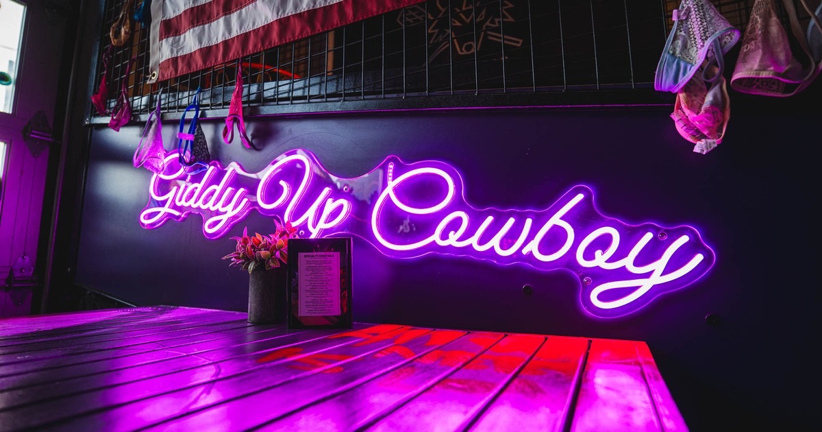 Giddy Up Cowboy neon writing