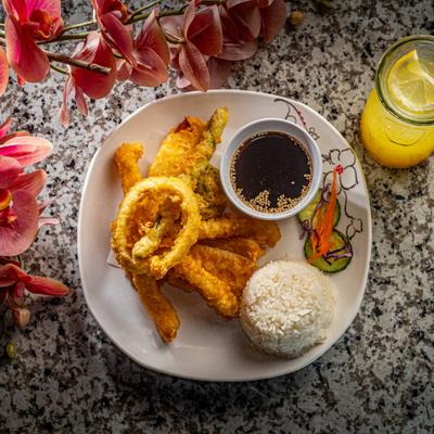 Shrimp and veggie tempura, with rice and dipping sauce.