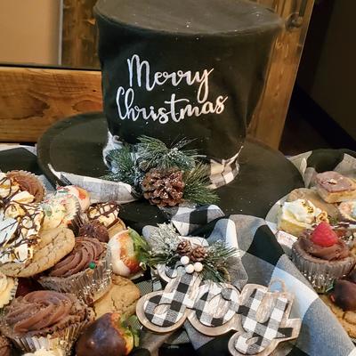 A festive dessert display with assorted cupcakes, topped with berries.