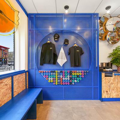 Various restaurant-branded apparel on display.