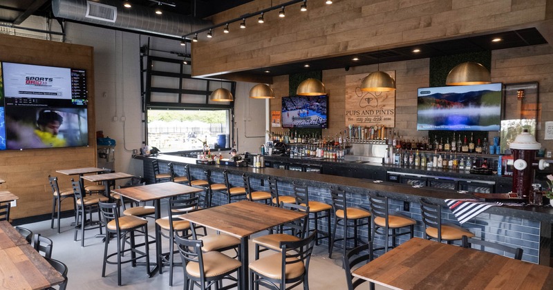 Interior seating and dining area, tall tables and bar stools