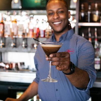 Bartender serving a cocktail