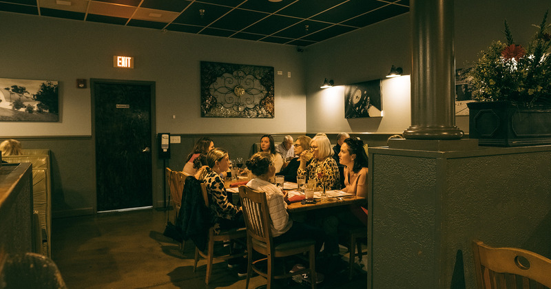 Interior, guests sitting in the dining area
