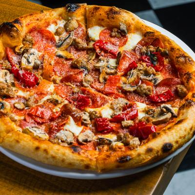 Handcrafted Italian pizza topped with Hungarian peppers, mushrooms, pepperoni and cheese.