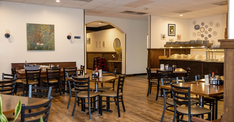 Interior, tables and chairs in dining area