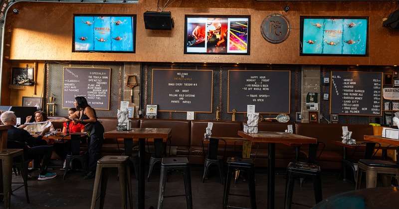 Interior, seating area, TV sets on the wall