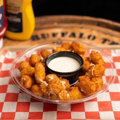 Cheese curds with dipping sauce.