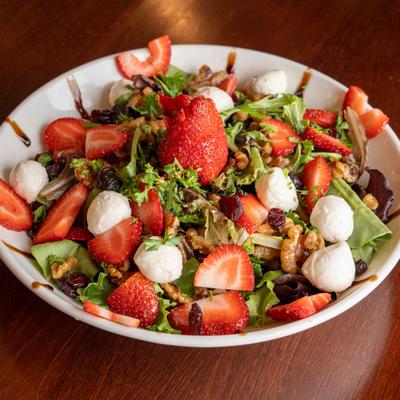 A served strawberry salad.