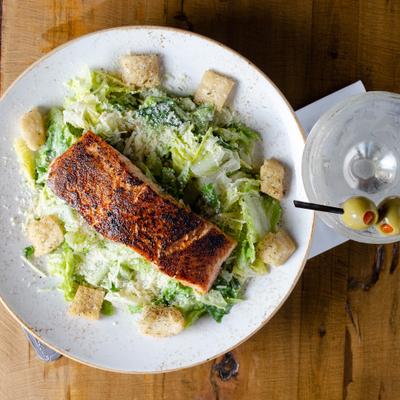 Blackened salmon caesar,pan seared with cajun seasoning.