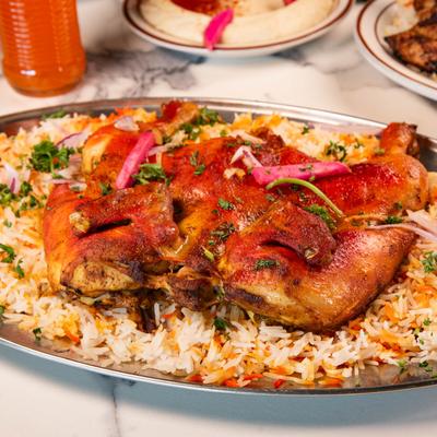 Roasted chicken served over rice.