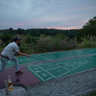 Customer playing shuffleboard.