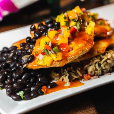 Grilled Chicken with wild rice, black beans, mango salsa and avocado