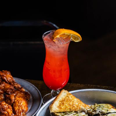 A served cocktail and meals.