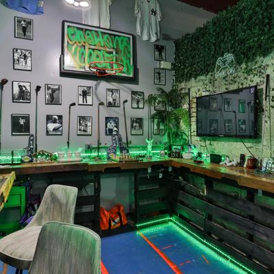 Corner bar setup with golf decor and neon lights.