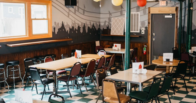 Dining tables and seating waiting to receive guests