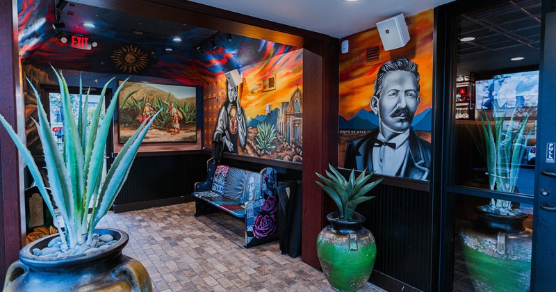 Interior, lobby with agave plants and mural art