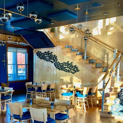 Downstairs seating area with the staircase leading to the upper floor