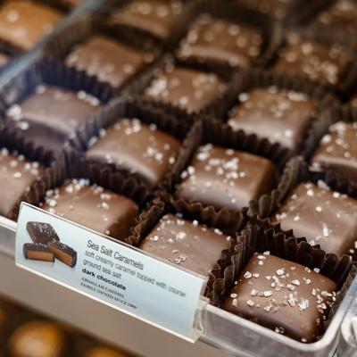 Salted caramel chocolates in a display tray.