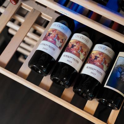Wine bottles on a wooden rack.
