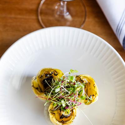 Served roasted artichoke hearts, top view.