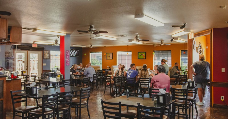 Interior, guests dining in the dining area