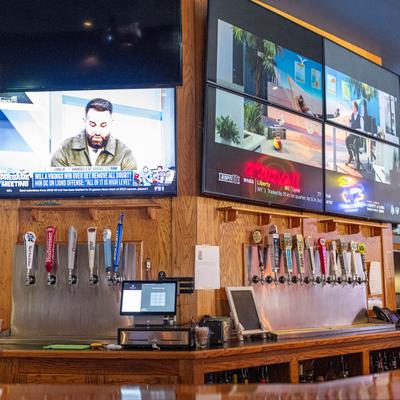 Flat screen TVs above the bar.