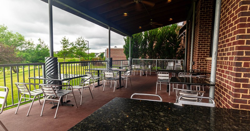 Exterior, patio area with marble tables