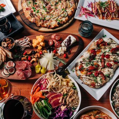 Assortment of dishes spread on the table, overhead view.