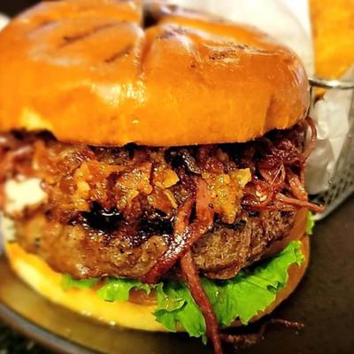 Burger with pulled pork and BBQ sauce.